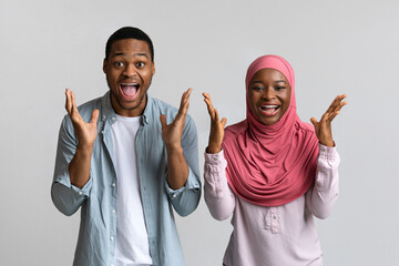 Wall Mural - Glad black couple screaming and looking at camera