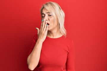 Poster - Young blonde girl wearing casual clothes bored yawning tired covering mouth with hand. restless and sleepiness.