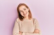 © Krakenimages.com - Young caucasian woman wearing casual clothes happy face smiling with crossed arms looking at the camera. positive person.