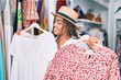 © Krakenimages.com - Young african american woman smiling happy at retail shop