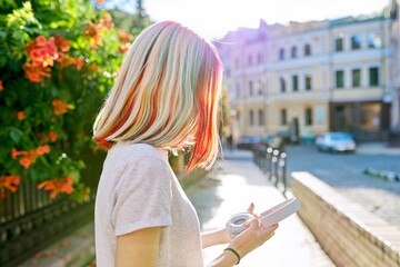 Wall Mural - Close-up of teenager girl's head with multi-colored dyed hair, complex coloring