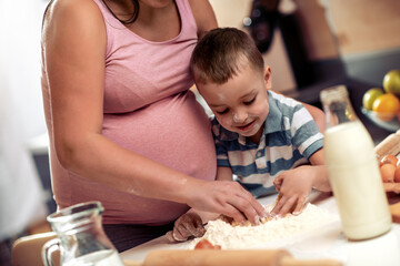 Poster - Mother  and son have fun in the kitchen