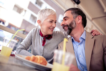 Wall Mural - Senior couple having breakfast together