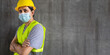 © anut21ng Stock - Portrait construction worker wearing a face mask safety Coronavirus 2019 (COVID-19) on cement wall background with copy space