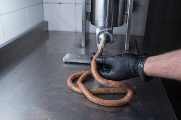 The chef makes minced pork sausages. Natural food in a pub