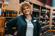 © Jacob Lund - Confident liquor store employee
