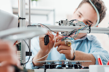 Young engineer using a 3D printer