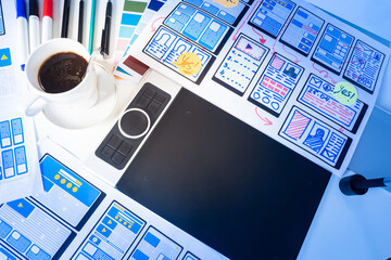 Wall Mural - the graphic designer workplace top view. graphic tablet, templates, coffee mug and stationery. devel