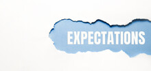 Inscription Expectations Word On Blue Torn Papper