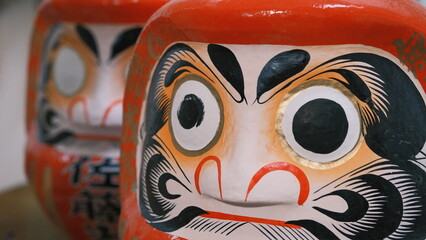 traditional japanese daruma eye being painted