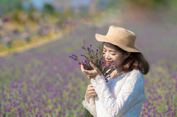 Wall Mural - little girl in a field of flowers