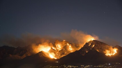 Wall Mural - Night Timelapse of Massive Wildfire and Moonrise Above Urban City Area of Tucson Arizona USA. Out of Control Fire on Santa Catalina Mountains