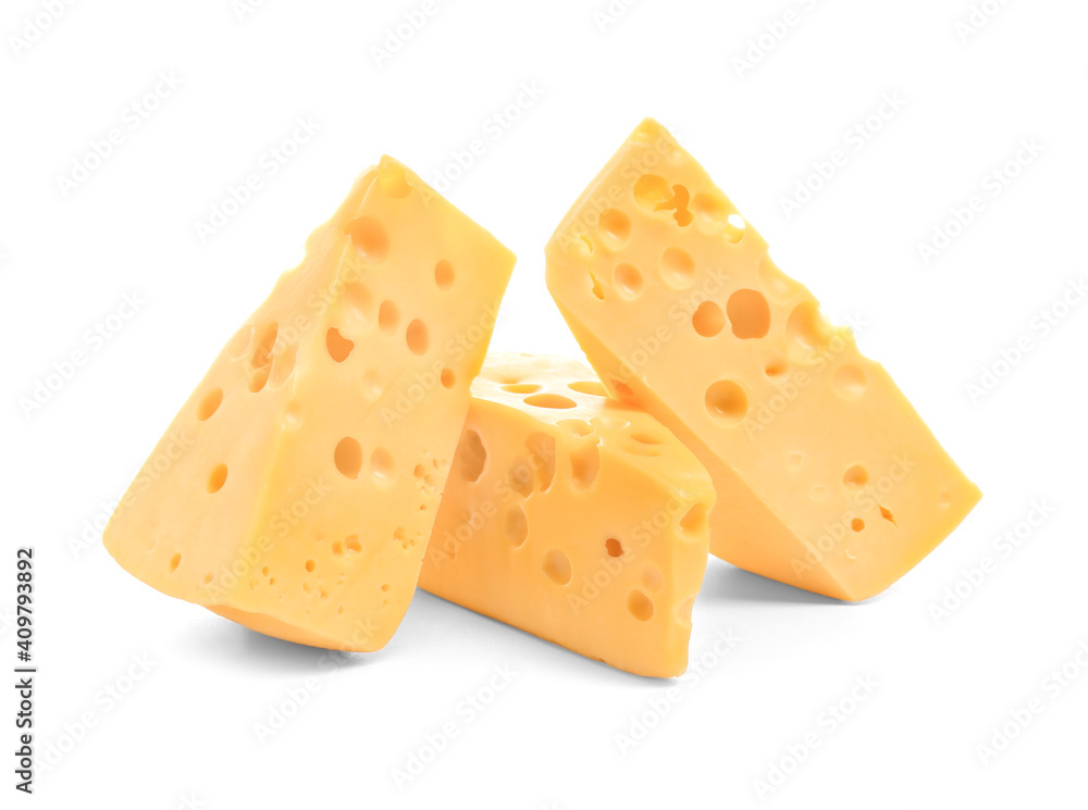 Pieces of tasty cheese on white background