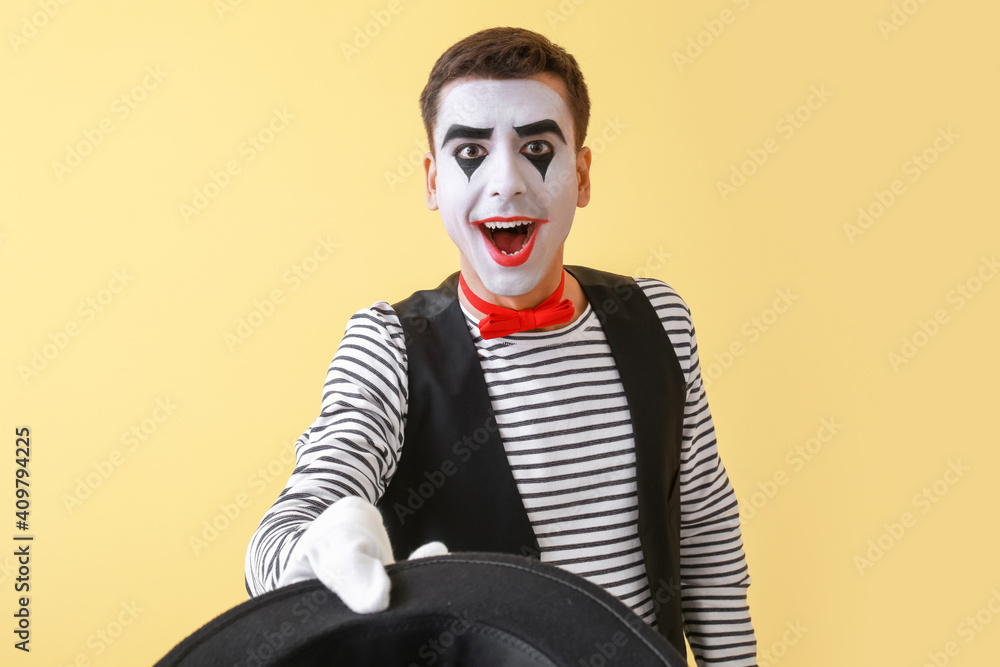 Male pantomimist on color background