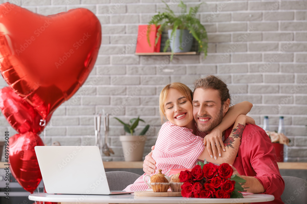 Young couple celebrating Valentine's Day at home