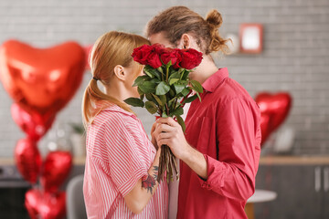 Poster - Young couple celebrating Valentine's Day at home