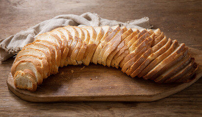 Canvas Print - sliced bread on wooden board