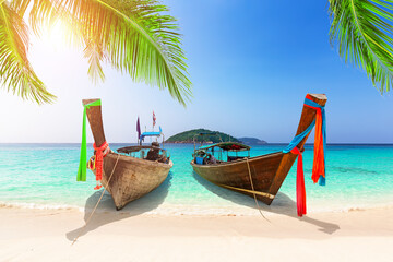 Wall Mural - Beautiful beach with thai traditional wooden longtail boat and blue sky in Similan islands, Thailand.