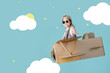 © DN6 - Asian little child girl playing with cardboard toy airplane handicraft Empty space isolated on blue long banner with copy space for your text, Creative with family and dreaming of flying concept
