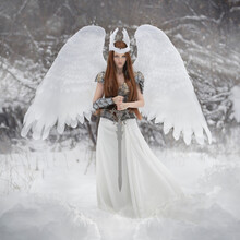 Art Photo Of An Angel Woman With White Wings And A Valkyrie Sword