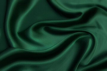 texture, background, pattern. texture of green silk fabric. beautiful emerald green soft silk fabric
