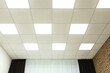 © New Africa - White ceiling with lighting in office room