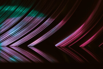 Fototapete - Close up Beautiful book pages in the multi color light on a night. Background pattern for design. Macro photography view.