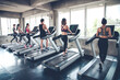 © P Stock - People jogging on treadmills.