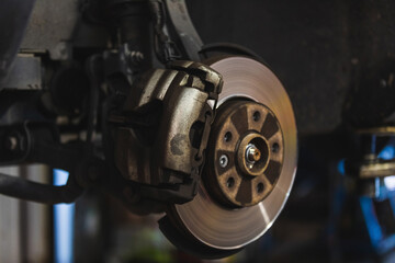 Wall Mural - Caliper and brake disc of the front wheel of the car. Mechanical concept.