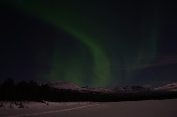 aurora borealis, northern light on winter night sky in northern norway