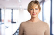 © gzorgz - Attractive blond haired businesswoman portrait while standing in the office