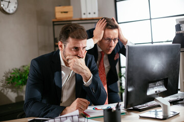 Colleagues in office. Two businessman discussing work in office..