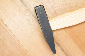 Poster - High angle shot of a bench hammer on a wooden surface