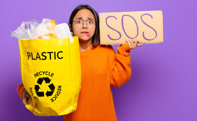 Wall Mural - young hispanis woman. recycle concept