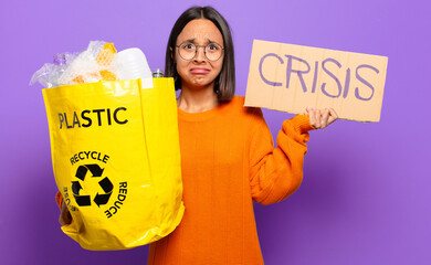 Wall Mural - young hispanis woman. recycle concept