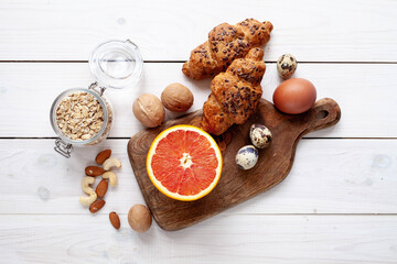 Wall Mural - Organic food: grapefruit, eggs, cereals, nuts, 