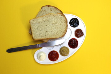 The palette includes mayonnaise, ketchup, mustard, jam and two types of jam with bread and a knife.