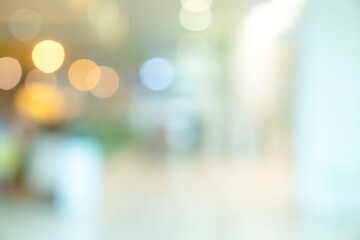 abstract blur image background of shopping mall with light bokeh and flare light bulb