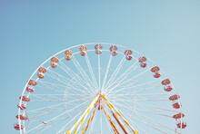 Picture Of A Ferris Wheel Against The Blue Sky, Retro Colors Toning Applied.