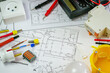 © Anna - Flat lay composition with electrician's tools on house plan. Space for text