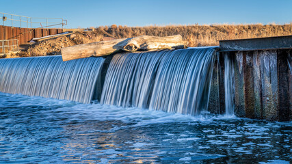 Canvas Print - river diversion dam on St Vrain Creek in northern Colorado near Platteville, winter scenery