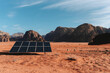 © Carlos Pintau/ADDICTIVE STOCK - Panel of modern solar battery installed on dry ground in Wadi Rum valley on sunny day
