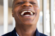 © David Munoz/ADDICTIVE STOCK - Satisfied African American male in casual outfit smiling and looking at camera on white background