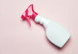 © Fatima Guisado/ADDICTIVE STOCK - High angle of plastic spray bottle placed on pink background in studio