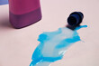 © Fatima Guisado/ADDICTIVE STOCK - Top view of liquid detergent spilled from plastic cap on pink background in studio
