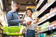 © Prostock-studio - Happy African Family Couple Buying Food In Supermarket