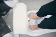 © Gabriel Trujillo/ADDICTIVE STOCK - From above of crop unrecognizable female client sitting with feet in bath massager during pedicure procedure in beauty salon