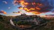 © Ivan Ferrero/ADDICTIVE STOCK - Panoramic view across river of old city Toledo in Spain with medieval castles and fortresses at sunset time with cloudy sky and reflection in river water