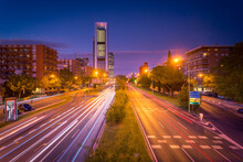 Magnificent View Of Asphalt Road With Traffic Light Trails At Dusk In Madrid