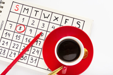 Closeup shot of a Women's day decoration set with a calendar marking the day